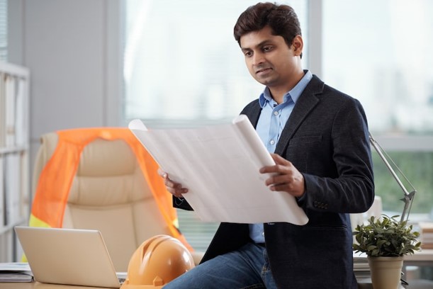 Contractor reviewing an insurance policy checklist on a job site